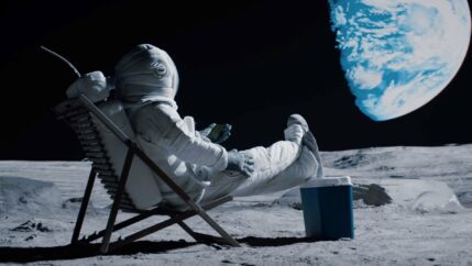 Back view of lunar astronaut opens a beer bottle while resting in a beach chair on Moon surface, enjoying view of Earth